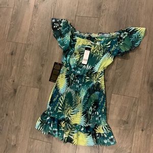 Bebe off the shoulder ruffle dress. NWT. Never worn.